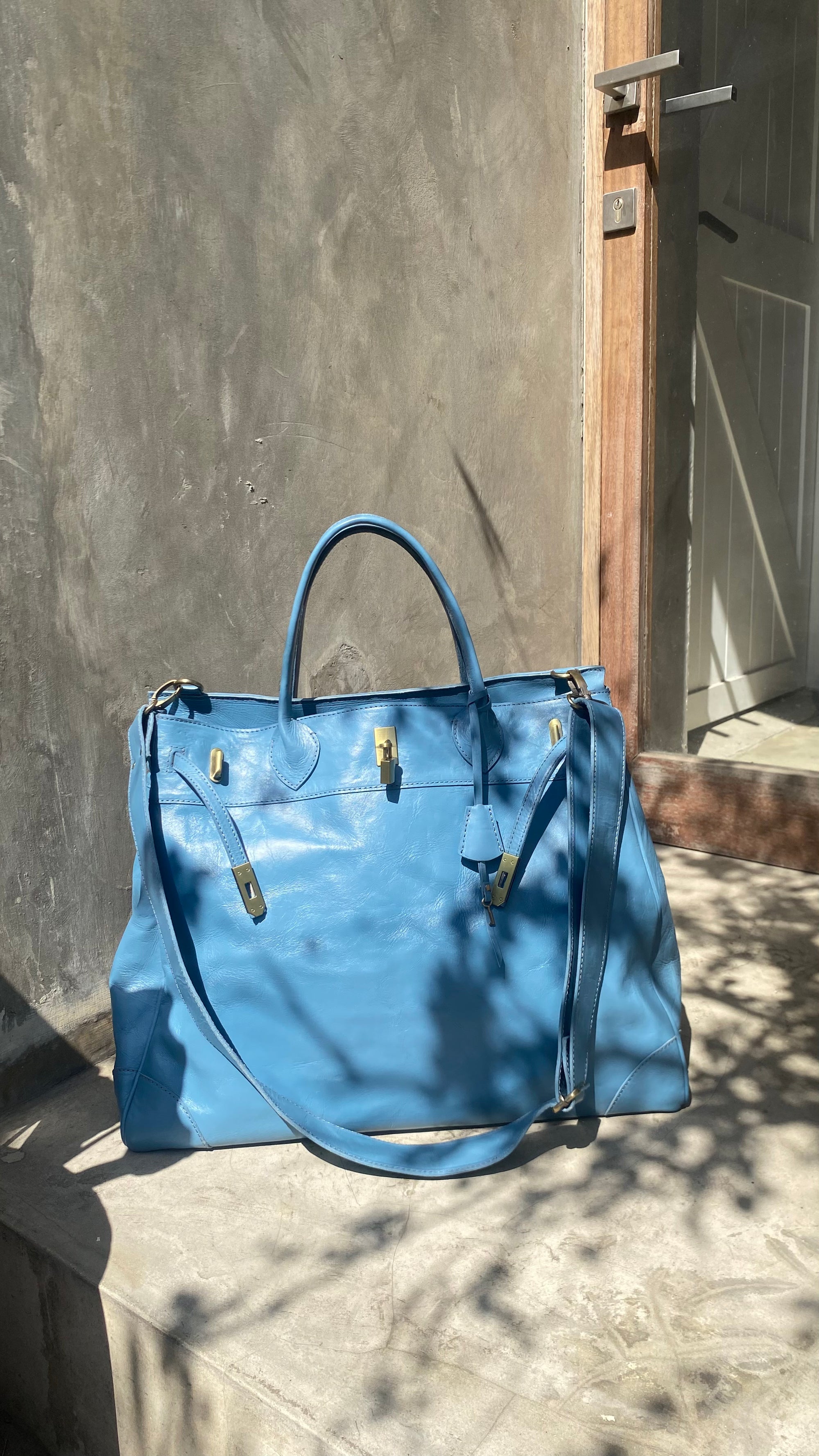 Blue full leather weekender strap